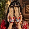 Red phulkari Punjabi jutti with colourful traditional embroidery